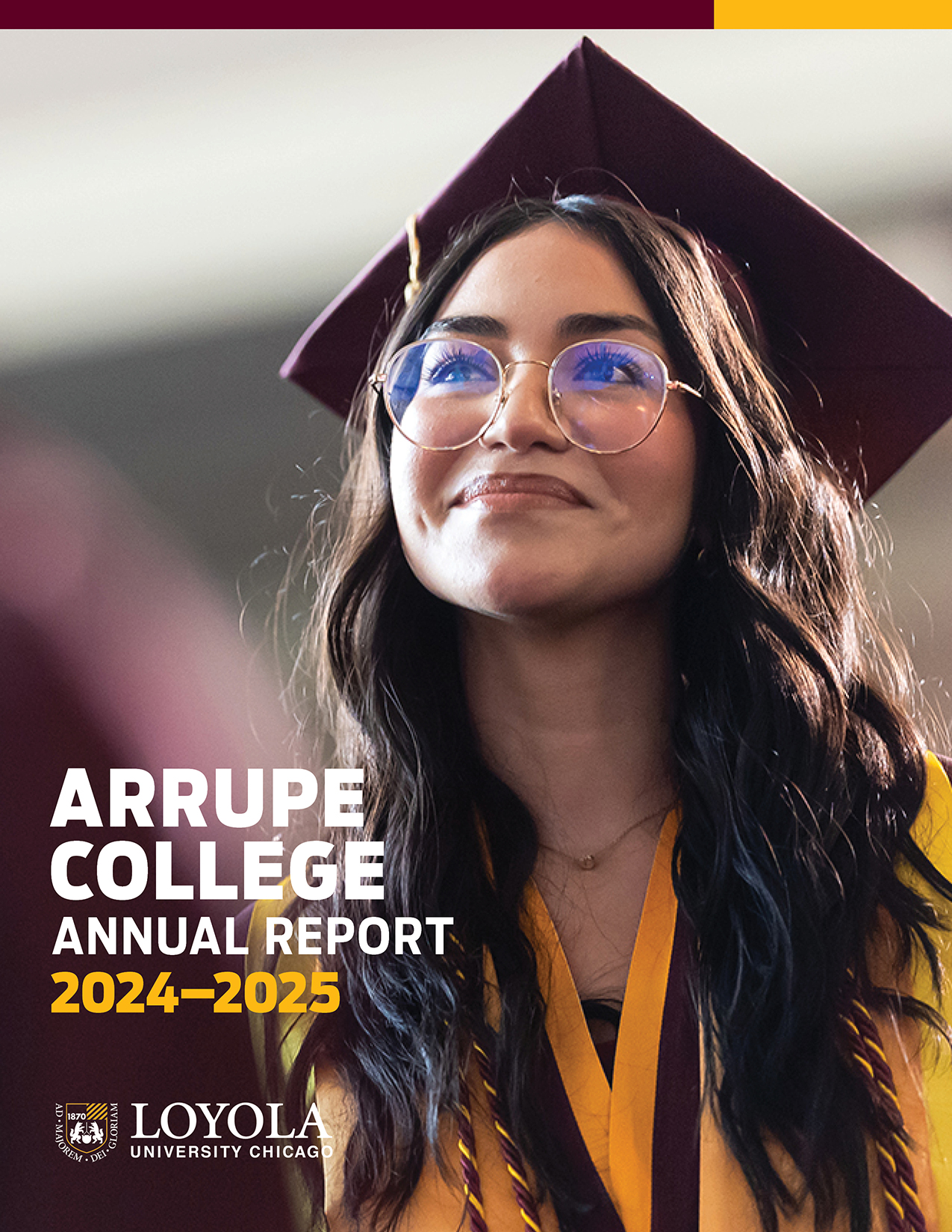 Arrupe College Annual Report cover featuring a smiling graduate in cap and gown